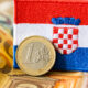 The Flag Of Croatia Against The Background Of The Single Currenc