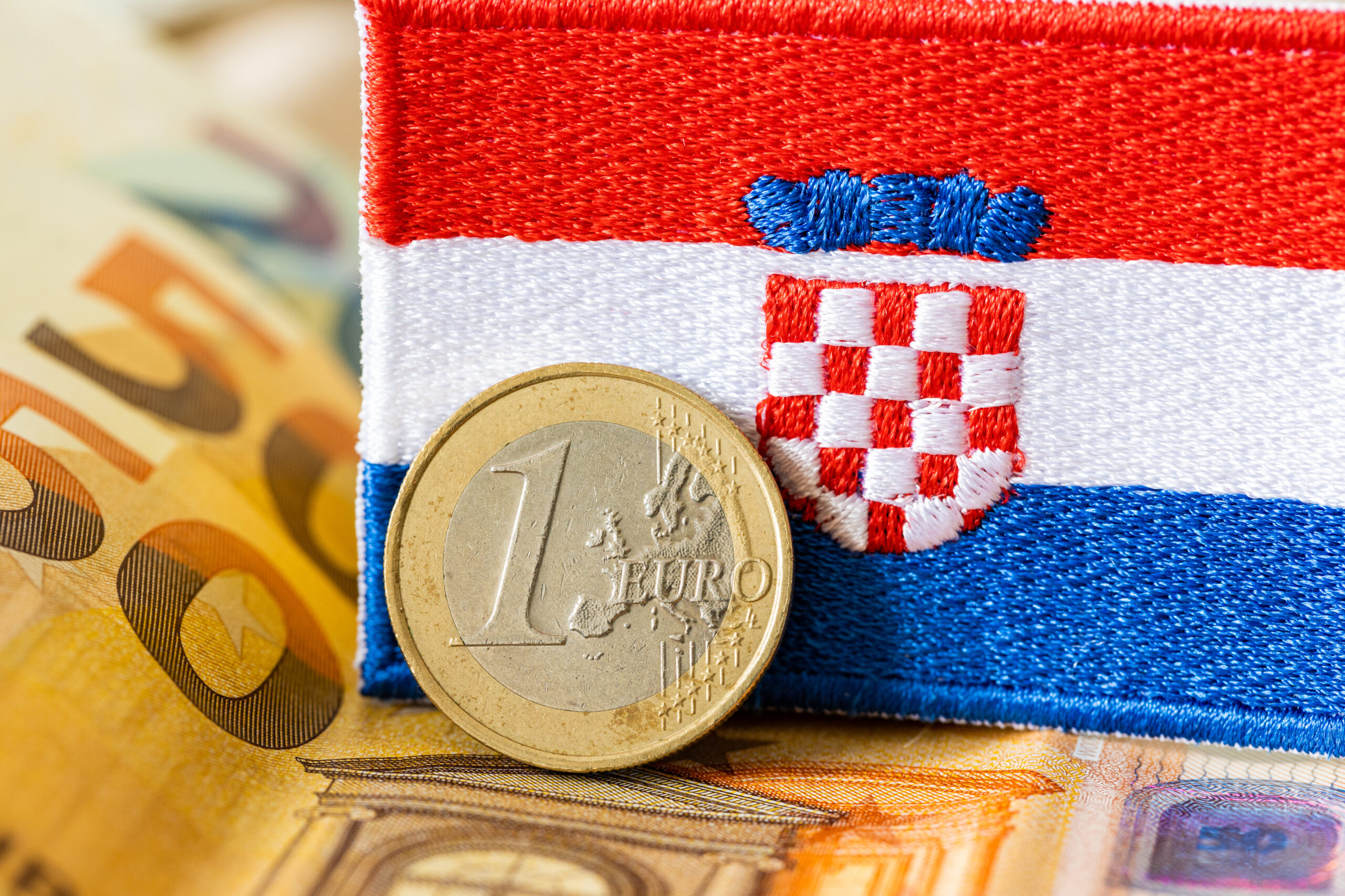 The Flag Of Croatia Against The Background Of The Single Currenc
